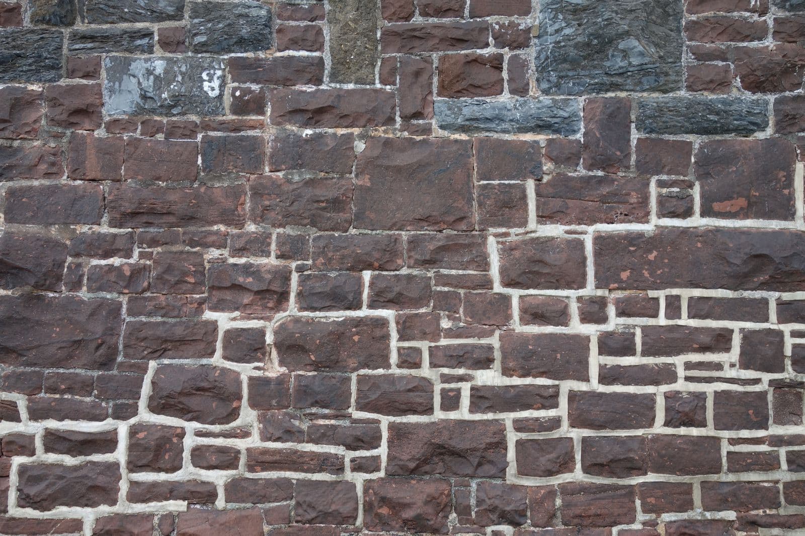 Old sandstone and brick wall